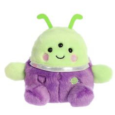 a green and purple stuffed animal with a smile on it's face