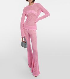 Crochet Flared Pants in Pink - Blumarine | Mytheresa Pink Flare Pants For Loungewear, Chic Cotton Pants With Flared Hem, Pink Stretch Long Pants Set, Pink Stretch Sets With Long Pants, Pink Flare Lounge Pants, Pink Wide Leg Flares For Spring, Trendy Fitted Pink Flares, Chic Pink Ruffled Sets, Chic Pink Flare Pants