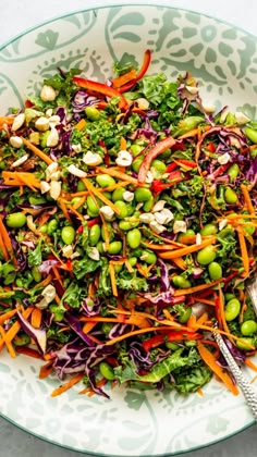 a salad with broccoli, carrots and edama sprouts