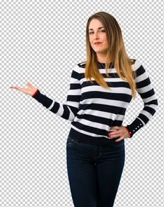 a woman in striped shirt posing with her hands out