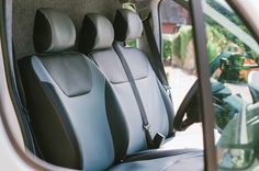 the interior of a vehicle with black seats