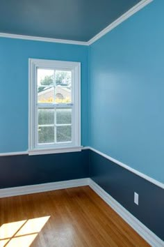 a room with blue walls and white trim on the wall is featured in this pinterest - friendly post