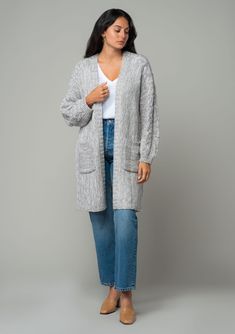 A cozy chunky knit cardigan with braided cable knit detail. FINAL SALE Chunky knit cardigan Relaxed fit Long sleeve with braided cable knit accent Mid-length Open front Side pockets Fall cardigan Your fall and winter wardrobe isn't complete without this chunky knit cardigan. With its cozy long sleeves and braided cable knit accents, it's the perfect blend of comfort and style. The open front and side pockets make it as practical as it is chic. Whether you’re layering over denim or draping it ove Cable Knit Cardigan For Fall And Cold Weather, Oversized Gray Cable Knit Outerwear, Cozy Cable Knit Sweater Coat For Layering, Gray Cable Knit Sweater Coat For Fall, Gray Cable Knit Cardigan For Layering, Cozy Cable Knit Cardigan For Layering, Oversized Gray Cable Knit Cardigan, Fall Cable Knit Cardigan, Cable Knit Sweater Coat For Cold Weather