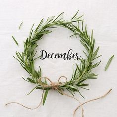 a wreath with the word december written on it