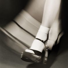 black and white photograph of woman's legs in high heels