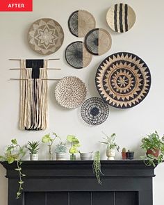 a living room with a fire place and lots of plates on the wall above it