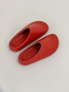 The top of the red clogs for women is made from red genuine leather, adding a touch of elegance to their whimsical aesthetic. Matching the upper, the insole also features a delightful red colour. These red barefoot clogs prioritize comfort with an orthopedic polyurethane sole covered in leather and EVA. The specialized sole provides optimal support, making them ideal for all-day wear. Additionally, the barefoot clogs feature a soft rim that enhances comfort and prevents any discomfort around the Red Flat Slip-ons With Leather Sole, Red Slip-ons With Rubber Sole, Comfortable Red Slippers With Rubber Sole, Red Slip-on Slippers With Rubber Sole, Red Slip-on Slippers With Leather Sole, Red Slip-on Mules With Leather Footbed, Red Leather Sole Slip-on Slippers, Red Comfortable Slip-on Slippers, Comfortable Red Slip-on Slippers