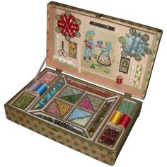 an open sewing box filled with different types of thread