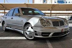 a silver car parked in a parking lot