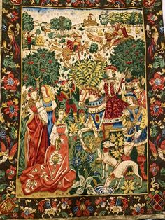 a tapestry with an image of people and animals