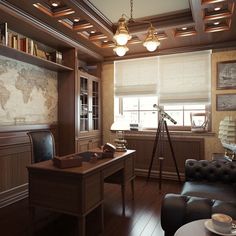 an office with a map on the wall, leather chair and desk in front of it