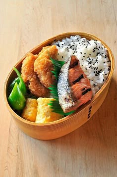 a wooden bowl filled with different types of food