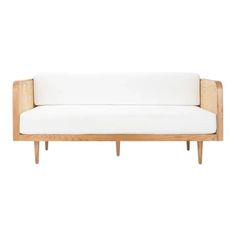 a white couch sitting on top of a wooden frame