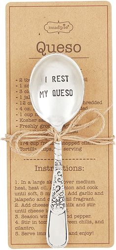 a spoon with the words i rest my queso written on it and tied in twine