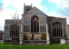 an old building with many windows on the front