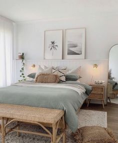 a bedroom with a bed, dresser and two framed pictures on the wall above it