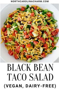 black bean taco salad with avocado, corn and tomatoes in a white bowl