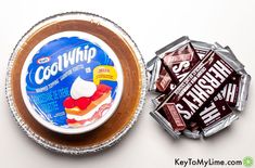 an assortment of chocolates and marshmallows on a white table with the words cool whip next to it