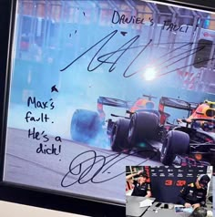 an autographed photo of red bull racing cars