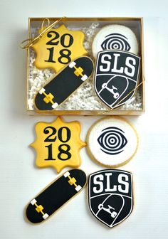 decorated cookies in a box with numbers and skateboards