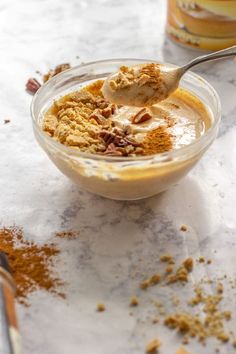 a bowl filled with food sitting on top of a table