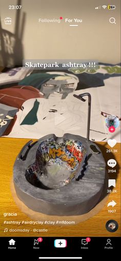 a wooden table topped with a metal bowl filled with lots of different types of items