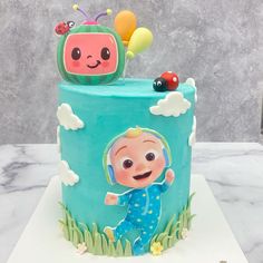 a blue cake with a cartoon character on it