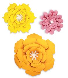 three paper flowers on a white background, one is yellow and the other is pink