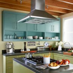 a stove top oven sitting inside of a kitchen next to a counter with food on it