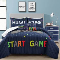 a bed room with a neatly made bed and game themed comforter on the bed