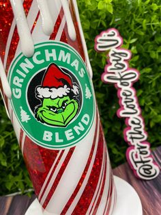 there is a red and white candy cane with the grinma's blend on it