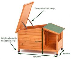 a wooden dog house with measurements for the top, bottom and side sections labeled in green