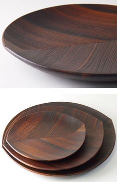 three wooden plates sitting on top of each other