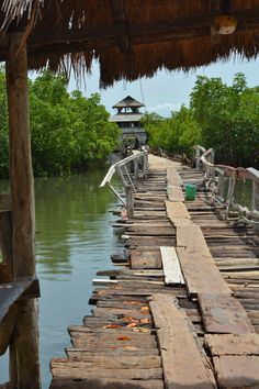 a long wooden dock with benches on it