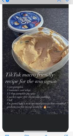 a bowl of ice cream sitting on top of a table next to a container of yogurt