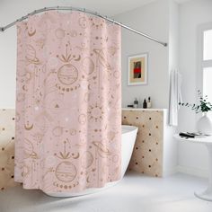 a bathroom with a pink shower curtain and white bathtub