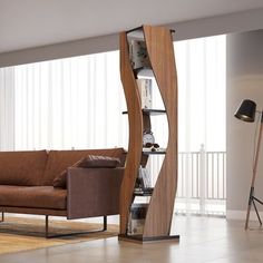 a living room filled with furniture and a tall wooden book shelf next to a window