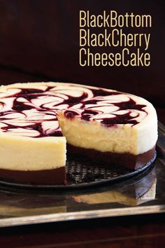 a cheesecake on a plate with one slice cut out and ready to be eaten