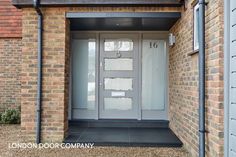 an entrance to a brick building with glass doors