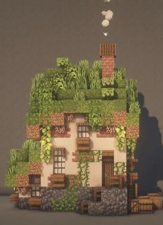 a small house with plants growing on the roof