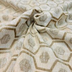 an up close shot of the fabric on a bed