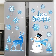 two refrigerators decorated with snowman and reindeer stickers