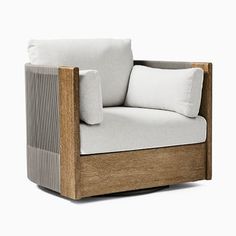 a wooden chair with two pillows on it's armrests and a white pillow