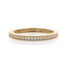 a yellow gold wedding band with rows of diamonds on the side and in the middle