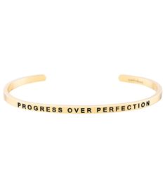 The Mantraband Progress Over Perfection Bracelet is an understated, everyday accessory with an engraved intention. It's a go-to gift, thanks to the gift-ready recyclable packaging with an inspirational message, specific to the mantra. Features "Progress Over Perfection"-engraved adjustable bracelet  Nickel and lead free Stainless steel, dipped in 18K gold Gift-ready, recyclable packaging Details Color: Yellow Gold Adjustable: Yes Materials: 18K gold dipped over stainless steel; lead free and nickel free Care: To clean, wipe items with a soft cloth. Avoid frequent contact with strong chemicals, such as detergent, bleach, perfume, etc. Store in a jewelry box or soft cloth. Always remember to remove your gold jewelry before shower or exercise. Do not wear items in hot tubs or swimming pools. Progress Over Perfection, Mantra Bands, Recyclable Packaging, Gold Gift, Hot Tubs, Everyday Accessories, Gold Dipped, Inspirational Message, Always Remember