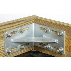 a wooden frame with metal brackets and screws