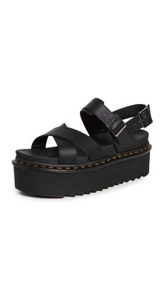 PRICES MAY VARY. EVA sole Crisscross straps, Platform profile and contrast welt stitching, Soft, molded footbed Heel: 2.75in / 70mm, Platform: 2.25in / 60mm Adjustable buckle straps Open toe A summertime classic gets the Dr. Martens treatment. These platform sandals feature the label's trademark contrast stitching and a super-comfortable molded footbed. Dr Martens Voss Ii, Dr Martens Voss, Dr Martens Womens, Sandal Platform, Shoe Inspiration, Karen Walker, Sandals Black, Toe Designs, Velcro Straps