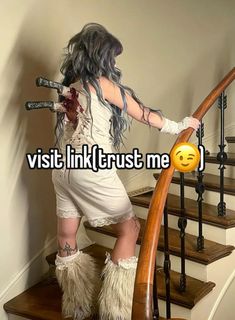 a woman in white dress standing on stairs next to a stair case with the caption visit link trust me