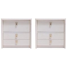 pair of white nightstands with brass handles