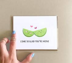 a hand holding up a card with two slices of limes on it that says, i'm no glad you're mine